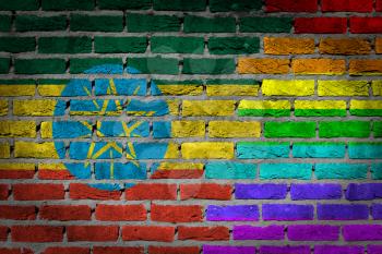 Dark brick wall texture - coutry flag and rainbow flag painted on wall - Ethiopia