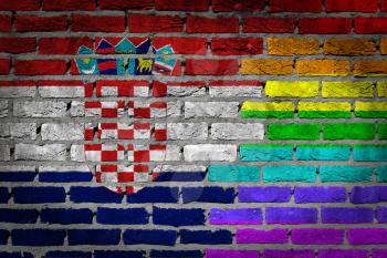 Dark brick wall texture - coutry flag and rainbow flag painted on wall - Croatia