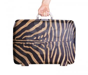 Used plastic suitcase with stains and scratches, zebra print