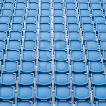 Blue seat in sport stadium, empty seats ready for the public