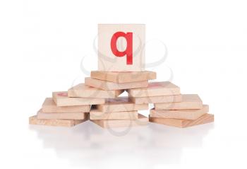 Alphabet - abstract of vintage wooden blocks - letter Q