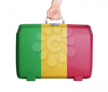 Used plastic suitcase with stains and scratches, printed with flag, Mali