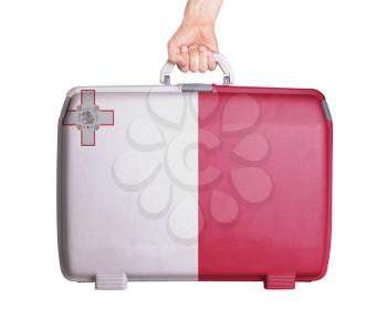 Used plastic suitcase with stains and scratches, printed with flag, Malta