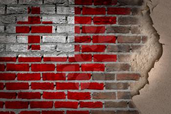 Dark brick wall texture with plaster - flag painted on wall - Tonga