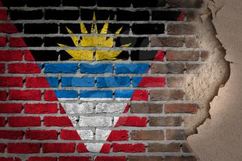 Dark brick wall texture with plaster - flag painted on wall - Antigua and Barbuda