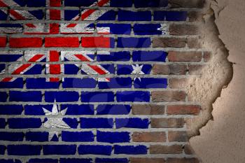 Dark brick wall texture with plaster - flag painted on wall - Australia