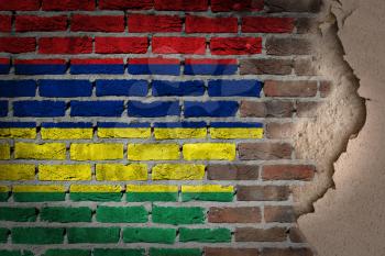 Dark brick wall texture with plaster - flag painted on wall - Mauritius