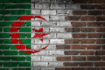 Very old dark red brick wall texture with flag - Algeria