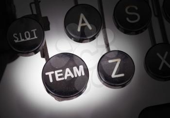 Typewriter with special buttons, team