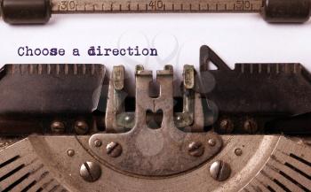 Vintage inscription made by old typewriter, choose a direction