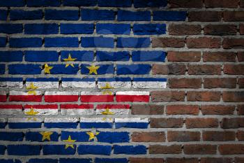 Very old dark red brick wall texture with flag - Cape Verde