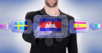 Hand pushing on a touch screen interface, choosing language or country, Cambodia