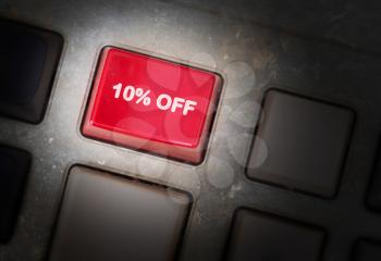Red button on a dirty old panel, selective focus - 10% off
