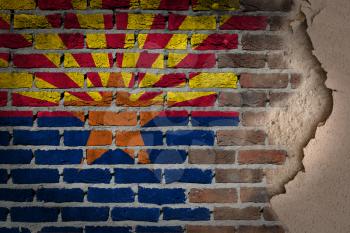 Dark brick wall texture with plaster - flag painted on wall - Arizona