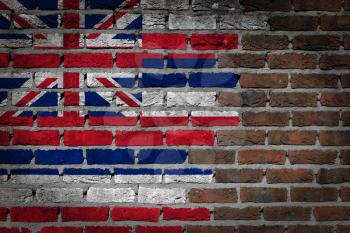 Very old dark red brick wall texture with flag - Hawaii