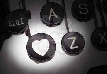 Typewriter with special buttons, heart