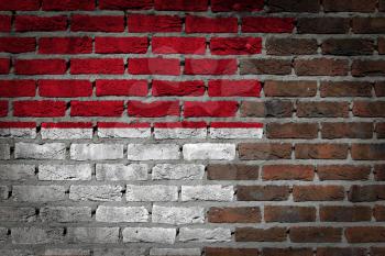 Very old dark red brick wall texture with flag - Indonesia