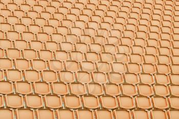 Orange seat in sport stadium, empty seats ready for the public
