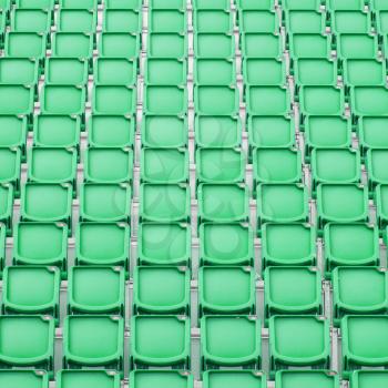 Green seat in sport stadium, empty seats ready for the public