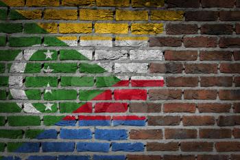 Very old dark red brick wall texture with flag - Comoros