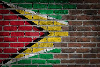 Very old dark red brick wall texture with flag - Guyana