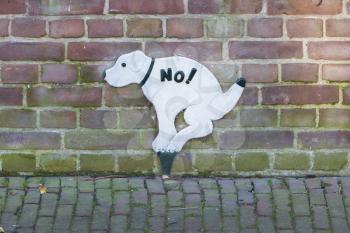 Sign prohibiting dogs to take a dump, street in the Netherlands