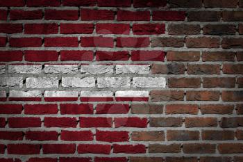 Very old dark red brick wall texture with flag - Latvia