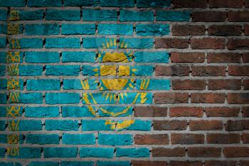 Very old dark red brick wall texture with flag - Kazakhstan