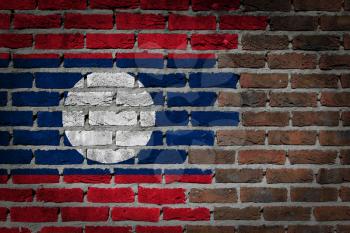Very old dark red brick wall texture with flag - Laos