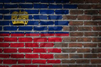 Very old dark red brick wall texture with flag - Liechtenstein