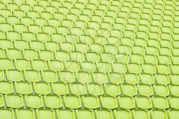 Yellow seat in sport stadium, empty seats ready for the public