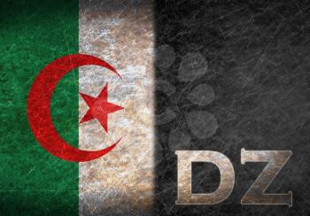 Old rusty metal sign with a flag and country abbreviation - Algeria