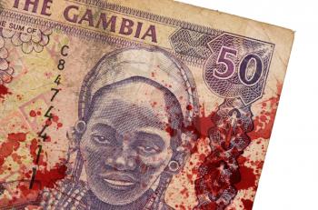 50 Gambian dalasi bank note, isolated on white, bloody