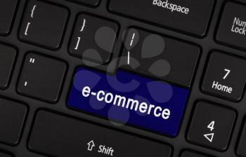 E-commerce and online shopping concept on a computer keyboard for Internet website and on line business