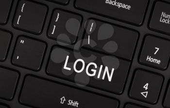 Black login button on modern laptop keyboard