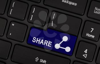 Blue share button on a laptop keyboard