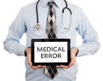 Doctor, isolated on white backgroun,  holding digital tablet - Medical error
