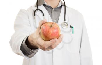 Nutritionist doctor, giving an apple, isolated on white