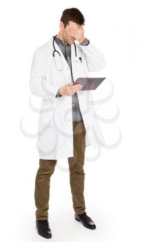 Male Caucasian doctor holding a digital tablet, looking shocked - Isolated on white