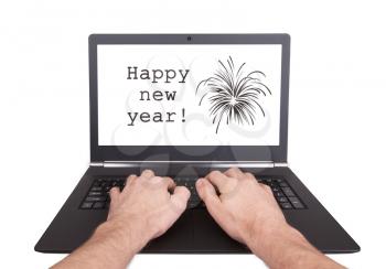 Man working on laptop, happy new year, isolated