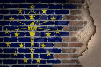 Dark brick wall texture with plaster - flag painted on wall - Indiana