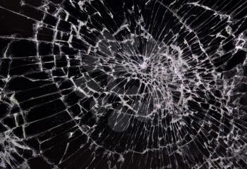 Broken glass, black background, concept of violence