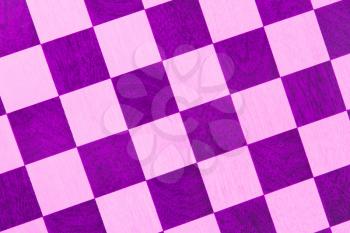 Very old wooden chess board, isolated close-up, purple
