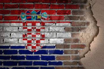 Dark brick wall texture with plaster - flag painted on wall - Croatia