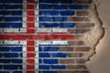 Dark brick wall texture with plaster - flag painted on wall - Iceland