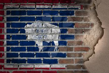 Dark brick wall texture with plaster - flag painted on wall - Wyoming