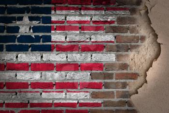 Dark brick wall texture with plaster - flag painted on wall - Liberia