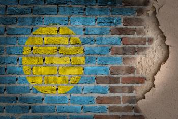 Dark brick wall texture with plaster - flag painted on wall - Palau