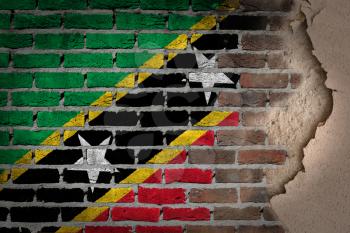 Dark brick wall texture with plaster - flag painted on wall - Saint Kitts and Nevis