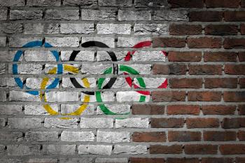 Very old dark red brick wall texture with flag - Olympic Rings